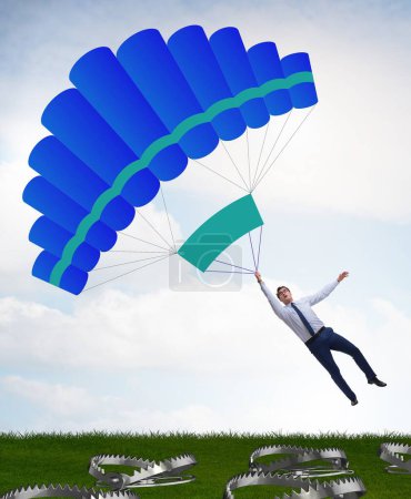 Photo for The businessman falling into trap on parachute - Royalty Free Image