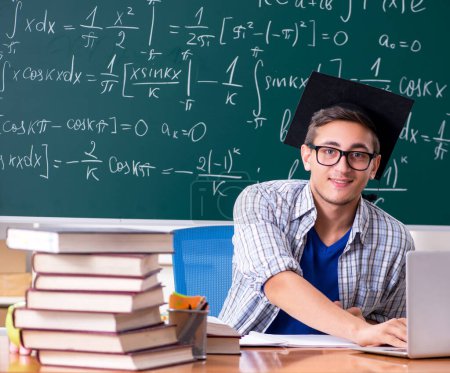 Photo for The young male student studying math at school - Royalty Free Image