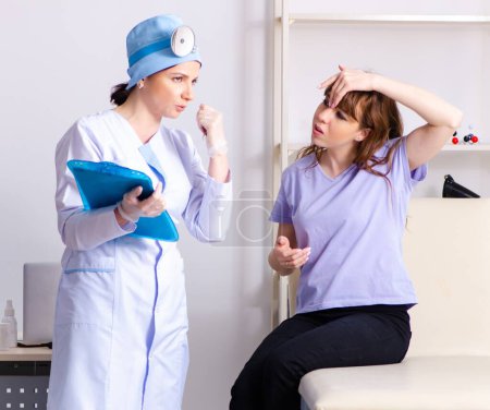 Photo for The young woman visiting female doctor otolaryngologist - Royalty Free Image