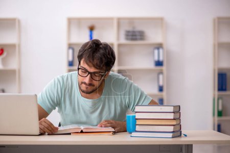 Photo for Young student preparing for exams in the classroom - Royalty Free Image