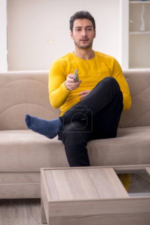 Photo for Young male student sitting at home during pandemic - Royalty Free Image
