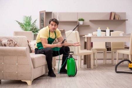 Photo for Young man cleaning the house - Royalty Free Image