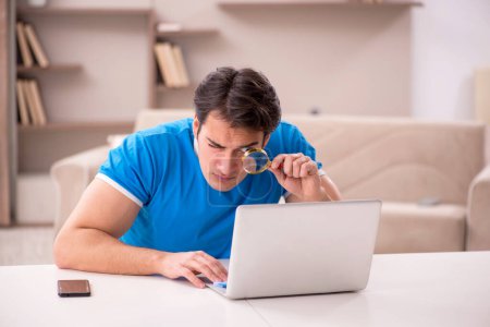 Photo for Young male freelancer working from home - Royalty Free Image