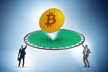 Photo for Monetary concept with cryptocurrency bouncing off trampoline - Royalty Free Image