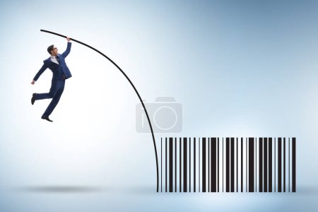 Photo for Businessman jumping over bar code in the pole vaulting - Royalty Free Image