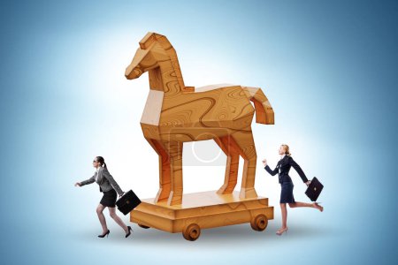 Photo for Businesswoman and trojan horse in the trap concept - Royalty Free Image