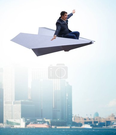 Photo for The businessman flying on paper plane in business concept - Royalty Free Image