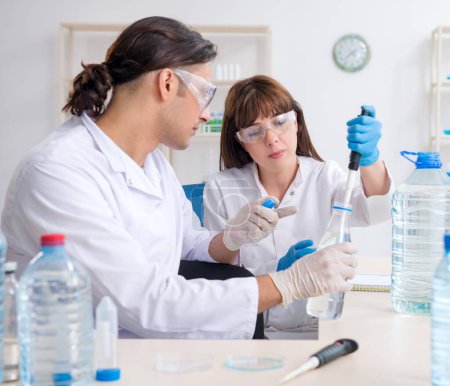 Photo for The two chemists working in the lab - Royalty Free Image