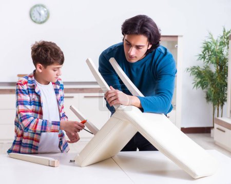 Photo for The young carpenter teaching his son - Royalty Free Image