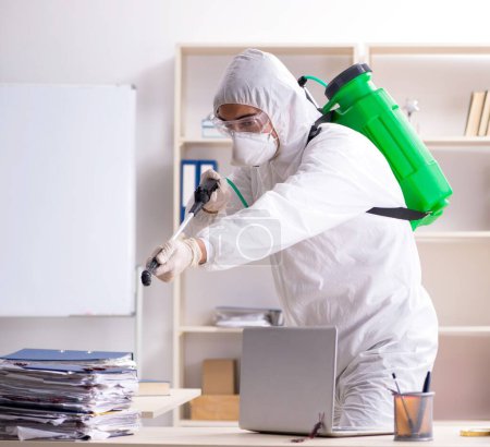 Photo for The professional contractor doing pest control at office - Royalty Free Image