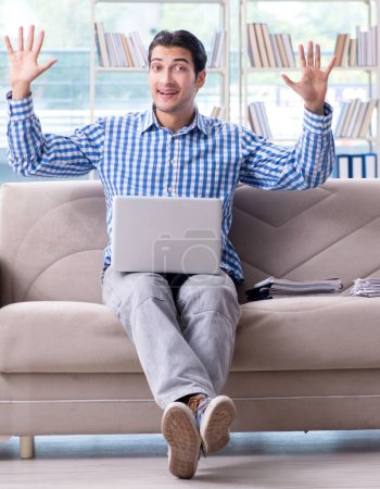 Photo for The caucasian student with laptop preparing for university exams - Royalty Free Image