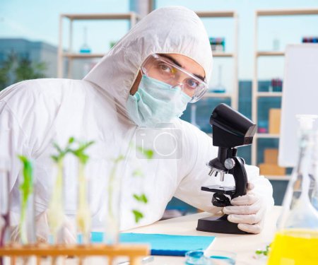 Photo for The male biotechnology scientist chemist working in the lab - Royalty Free Image