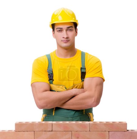 Photo for The the handsome construction worker building brick wall - Royalty Free Image