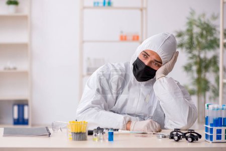 Photo for Young chemist working at the lab during pandemic - Royalty Free Image