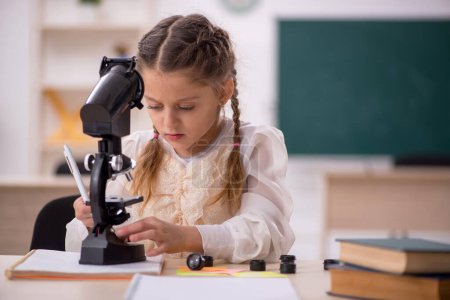 Photo for Little girl studying in the classroom - Royalty Free Image