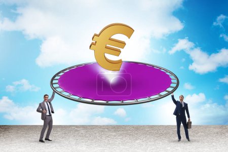 Foto de Monetary concept with currency bouncing off trampoline - Imagen libre de derechos