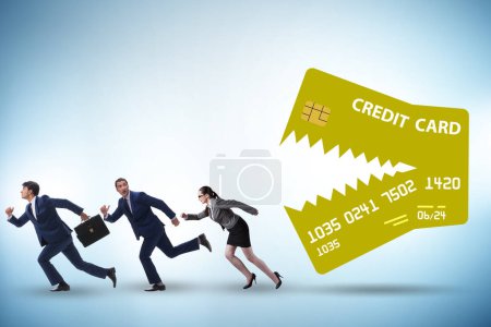 Téléchargez les photos : Les gens d'affaires dans le concept de la dette par carte de crédit - en image libre de droit