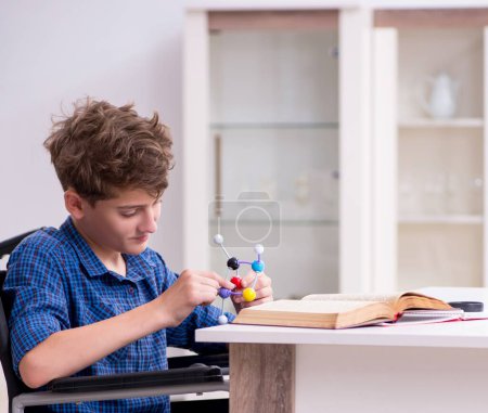 Photo for The disabled kid preparing for school at home - Royalty Free Image