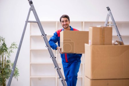 Photo for Young contractor doing home relocation - Royalty Free Image
