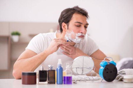 Photo for Young man shaving at home - Royalty Free Image