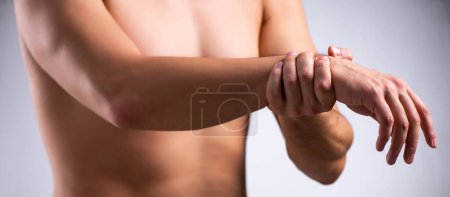 Photo for The young man suffering from upper limb pain - Royalty Free Image