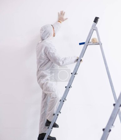 Photo for Painter working at the construction site - Royalty Free Image