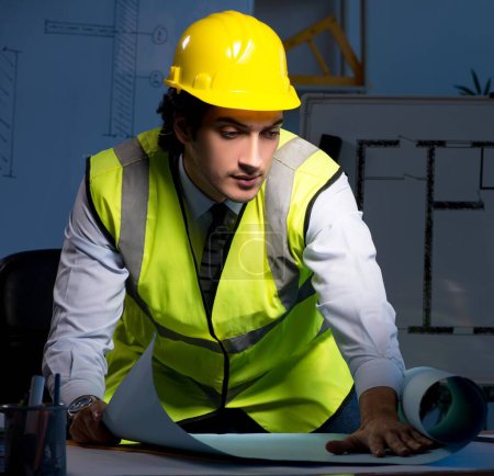 Photo for The young construction architect working on project at night - Royalty Free Image