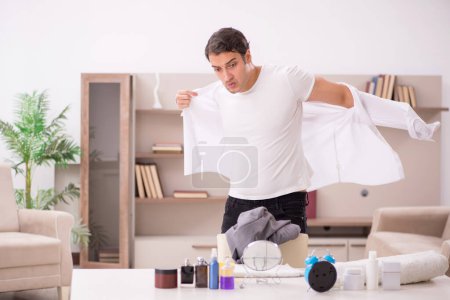 Photo for Young employee getting up late at home - Royalty Free Image