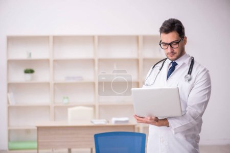 Photo for Young doctor in telemedicine concept - Royalty Free Image