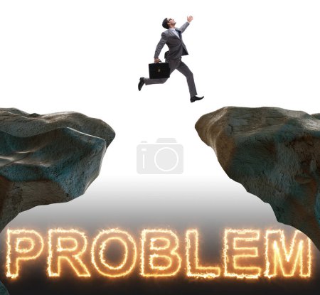 Photo for The businessman jumping over burning problems - Royalty Free Image