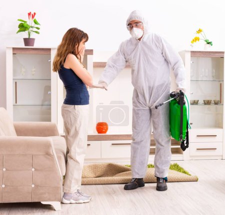 Photo for The young professional contractor doing pest control at flat - Royalty Free Image