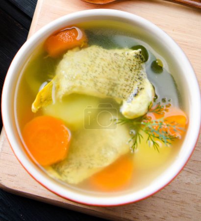 Photo for Fish soup served on the table in plate - Royalty Free Image