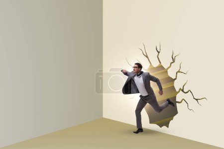 Photo for Businessman breaking through a wall - Royalty Free Image