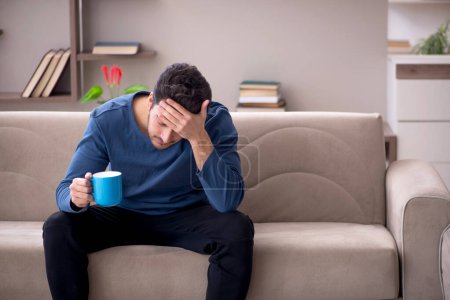 Photo for Young man sitting at home - Royalty Free Image