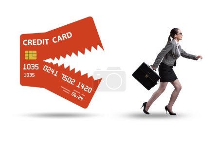 Téléchargez les photos : Businesswoman in the credit card debt concept - en image libre de droit