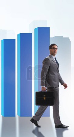 Photo for The young businessman in business concept with bar charts - Royalty Free Image