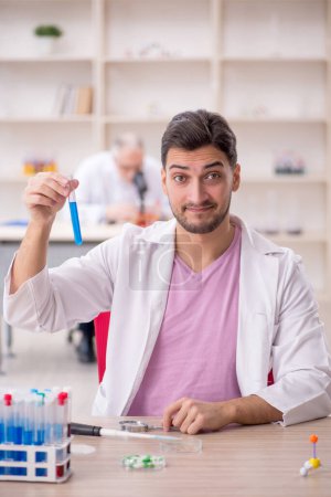 Photo for Two chemists working at the lab - Royalty Free Image