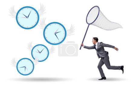 Téléchargez les photos : Concept de date limite avec l'homme d'affaires attrapant horloges - en image libre de droit