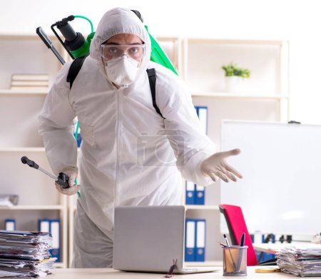 Photo for The professional contractor doing pest control at office - Royalty Free Image