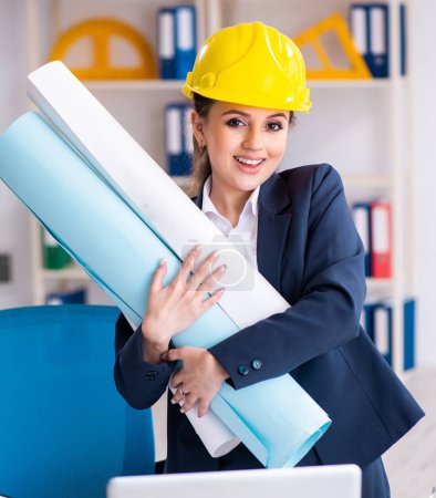 Photo for The young female architect working in the office - Royalty Free Image