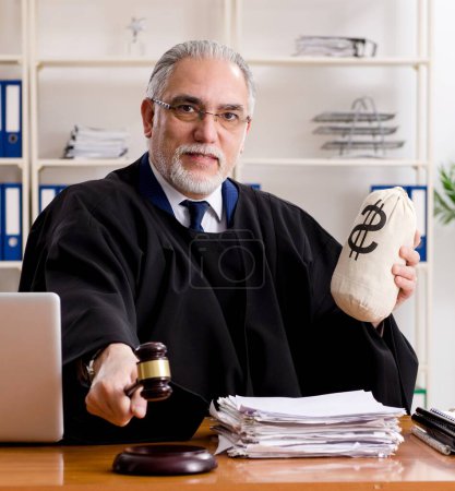 Photo for The aged lawyer working in the courthouse - Royalty Free Image