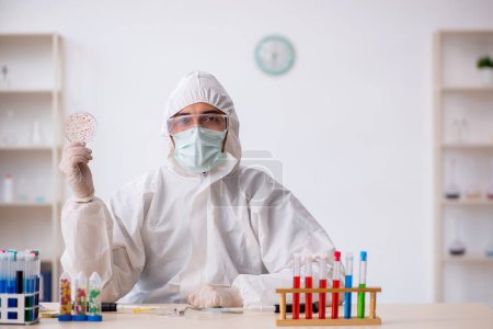 Photo for Young chemist in drugs synthesis concept - Royalty Free Image
