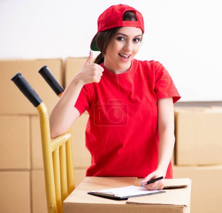 Photo for The young female professional mover doing home relocation - Royalty Free Image