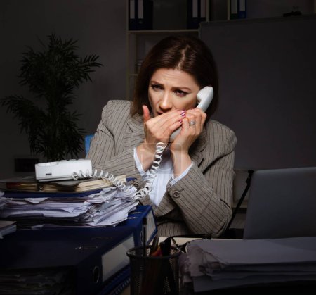 Photo for The female employee suffering from excessive work - Royalty Free Image