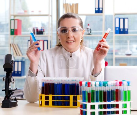 Photo for The female chemist working in medical lab - Royalty Free Image