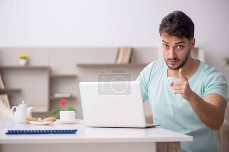 Photo for Young freelancer working from home during pandemic - Royalty Free Image