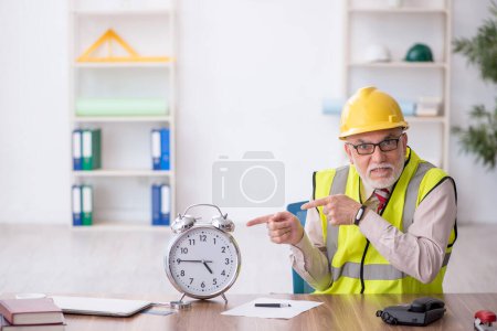 Photo for Old architect in time management concept - Royalty Free Image