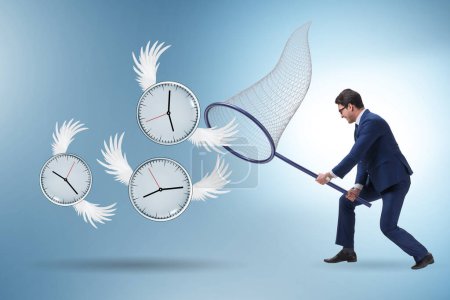 Photo for Deadline concept with the businessman catching clocks - Royalty Free Image