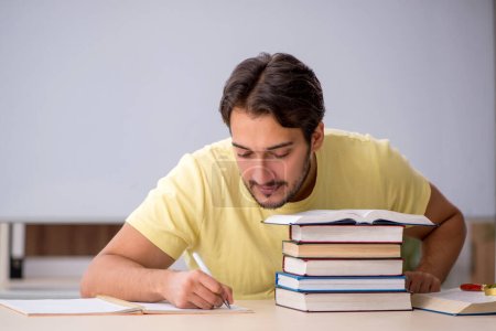 Photo for Young student preparing for exams in the classroom - Royalty Free Image