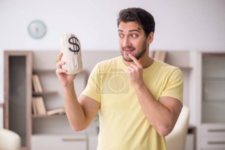 Photo for Young man in remuneration concept - Royalty Free Image